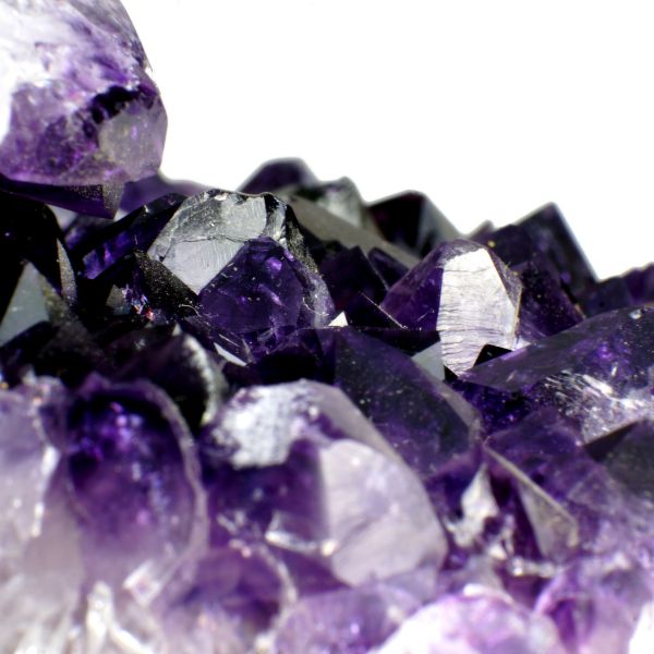 Deep-colored Amethyst immersed for a homeopathic remedy in a bottle, available in pillules, drops or spray formats